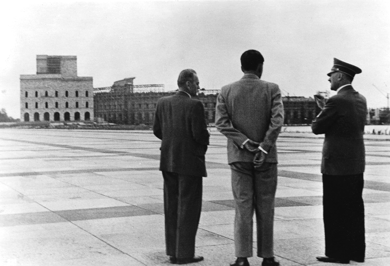 Adolf Hitler inspects the Nuremberg congress hall under construction and the 1:1 wooden model of the facade with Albert Speer and Nuremberg civil engineering consultant Walter Brugmann